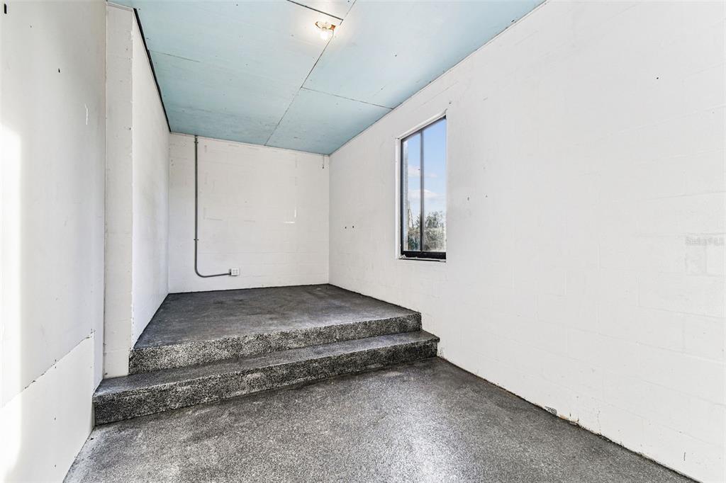 1734 Rumar Lane, Unit A Holiday, FL 34691 - Photo 19 of 100 a view of a room with wooden floor and window