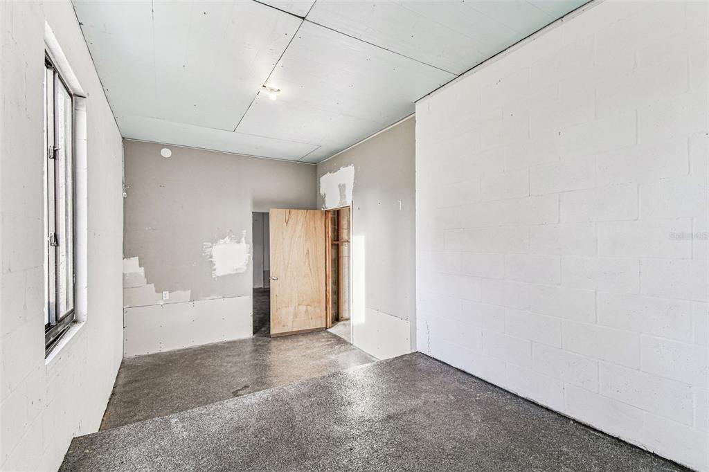 1734 Rumar Lane, Unit A Holiday, FL 34691 - Photo 21 of 100 a view of a big room with closet and windows