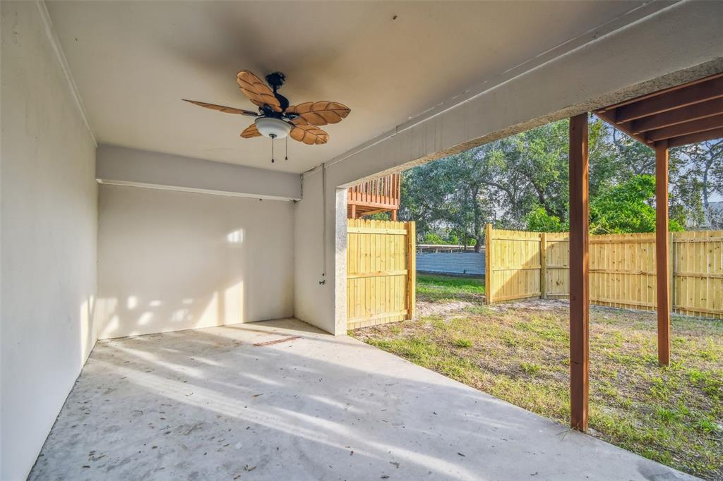 1734 Rumar Lane, Unit A Holiday, FL 34691 - Photo 24 of 100 a view of a room with a ceiling fan and window