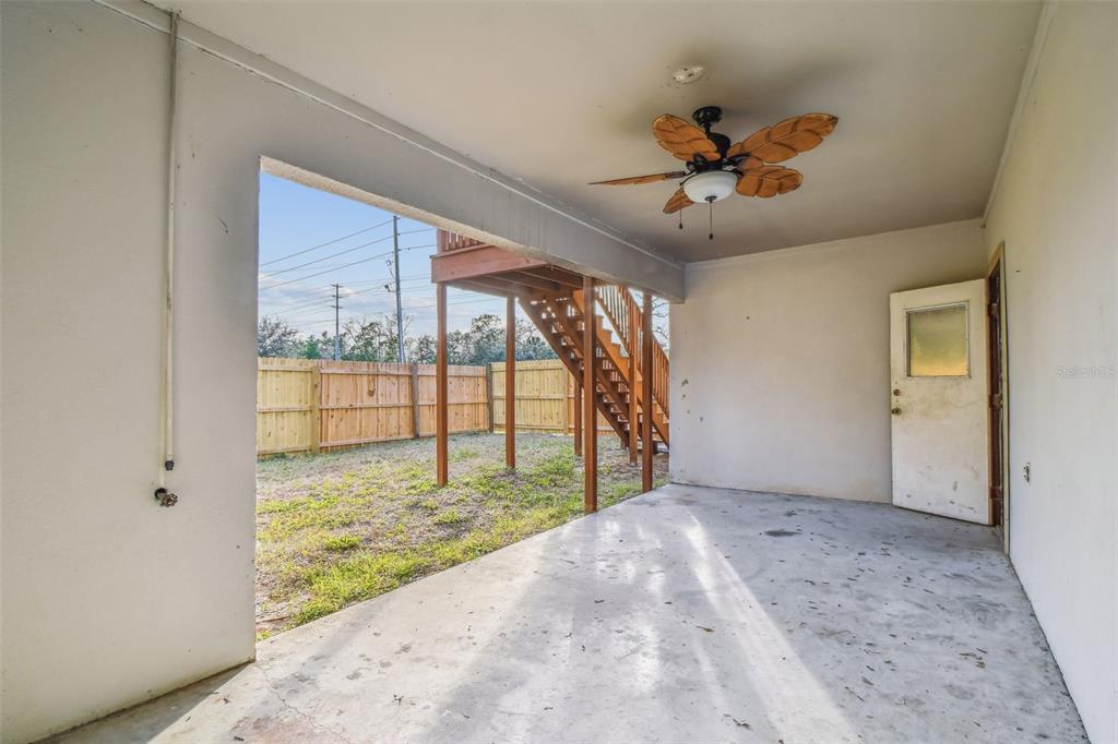 1734 Rumar Lane, Unit A Holiday, FL 34691 - Photo 26 of 100 a view of a livingroom with a ceiling fan and window