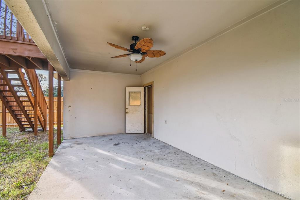 1734 Rumar Lane, Unit A Holiday, FL 34691 - Photo 27 of 100 a view of a livingroom with a ceiling fan and window