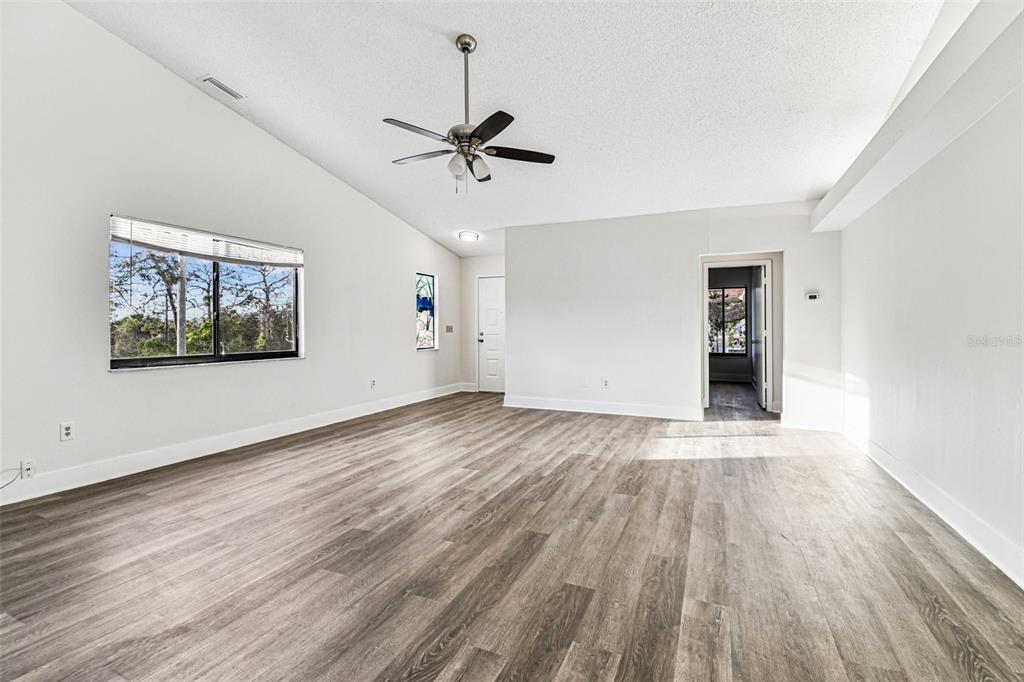 1734 Rumar Lane, Unit A Holiday, FL 34691 - Photo 38 of 100 a view of empty room with wooden floor