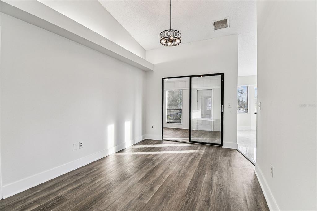 1734 Rumar Lane, Unit A Holiday, FL 34691 - Photo 41 of 100 a view of a room with wooden floor and a window