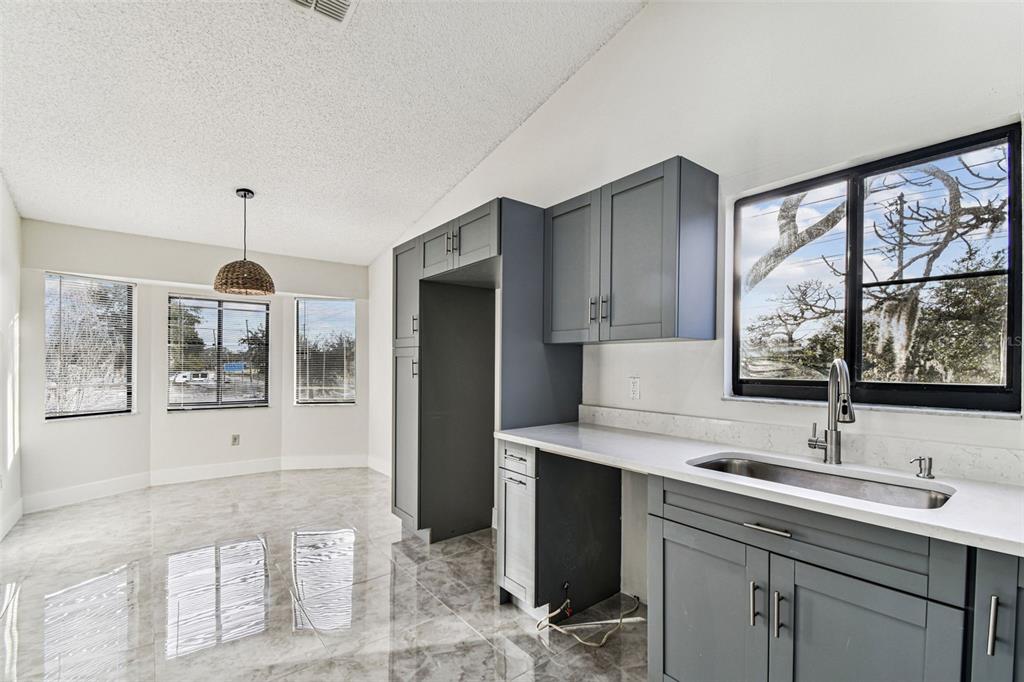 1734 Rumar Lane, Unit A Holiday, FL 34691 - Photo 47 of 100 a kitchen with a sink and large window