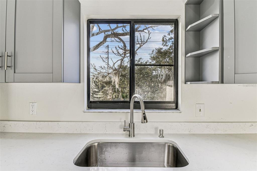 1734 Rumar Lane, Unit A Holiday, FL 34691 - Photo 48 of 100 a bathroom with a sink and a window