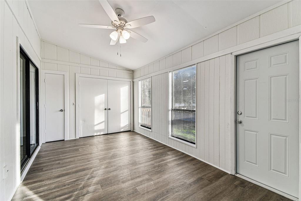1734 Rumar Lane, Unit A Holiday, FL 34691 - Photo 54 of 100 a view of an empty room with wooden floor
