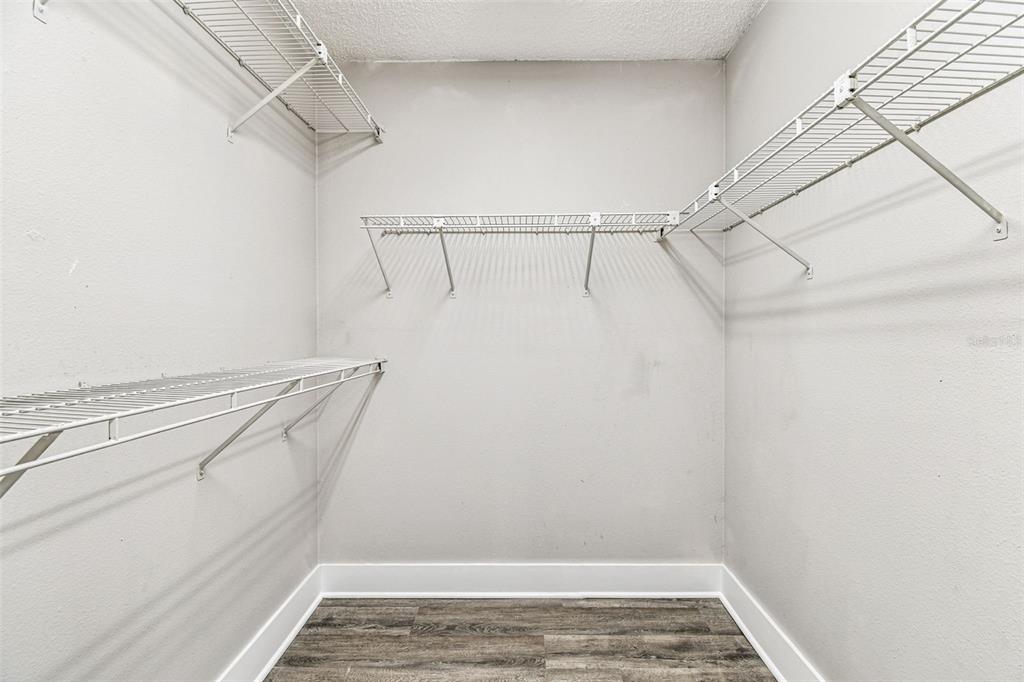 1734 Rumar Lane, Unit A Holiday, FL 34691 - Photo 67 of 100 a view of walk in closet with empty racks