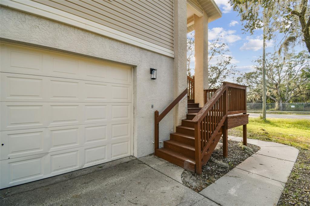 1734 Rumar Lane, Unit A Holiday, FL 34691 - Photo 8 of 100 a view of a house with backyard and wooden fence