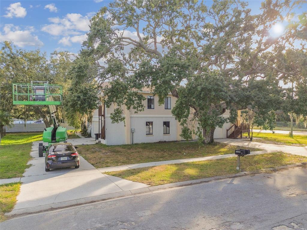 1734 Rumar Lane, Unit A Holiday, FL 34691 - Photo 88 of 100 a view of swimming pool with lawn chairs and plants