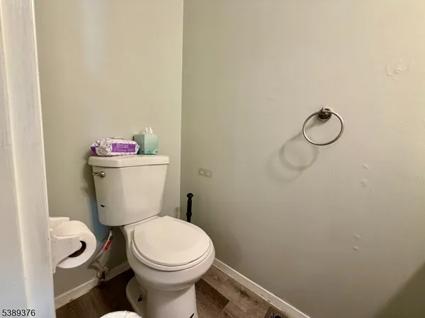 a white toilet sitting next to a bathroom sink