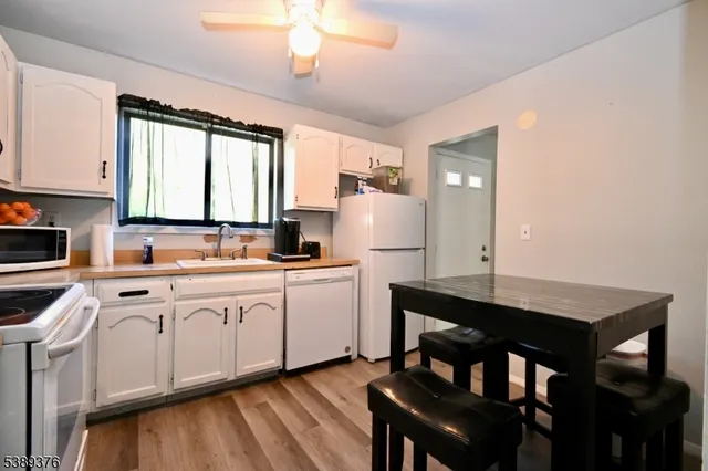 a kitchen with sink cabinets and window
