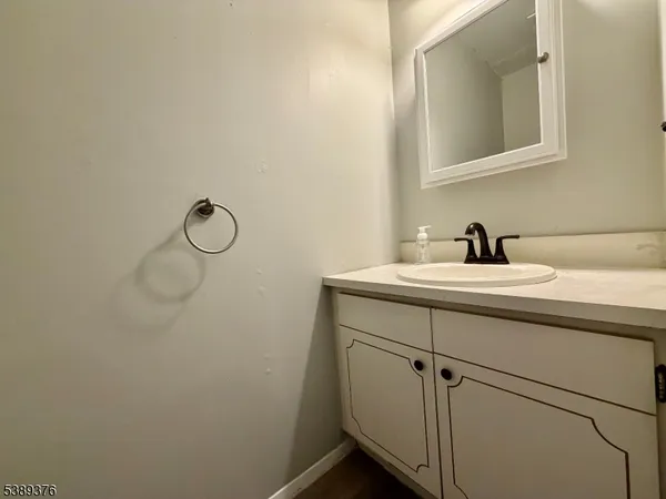 a bathroom with a sink and mirror