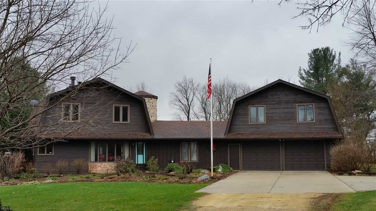 353 Cummings Road Caledonia, IL 61011 - Photo 1 of 24 a front view of a house with garden