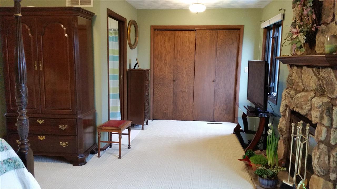 353 Cummings Road Caledonia, IL 61011 - Photo 13 of 24 a bedroom with a bed and a closet