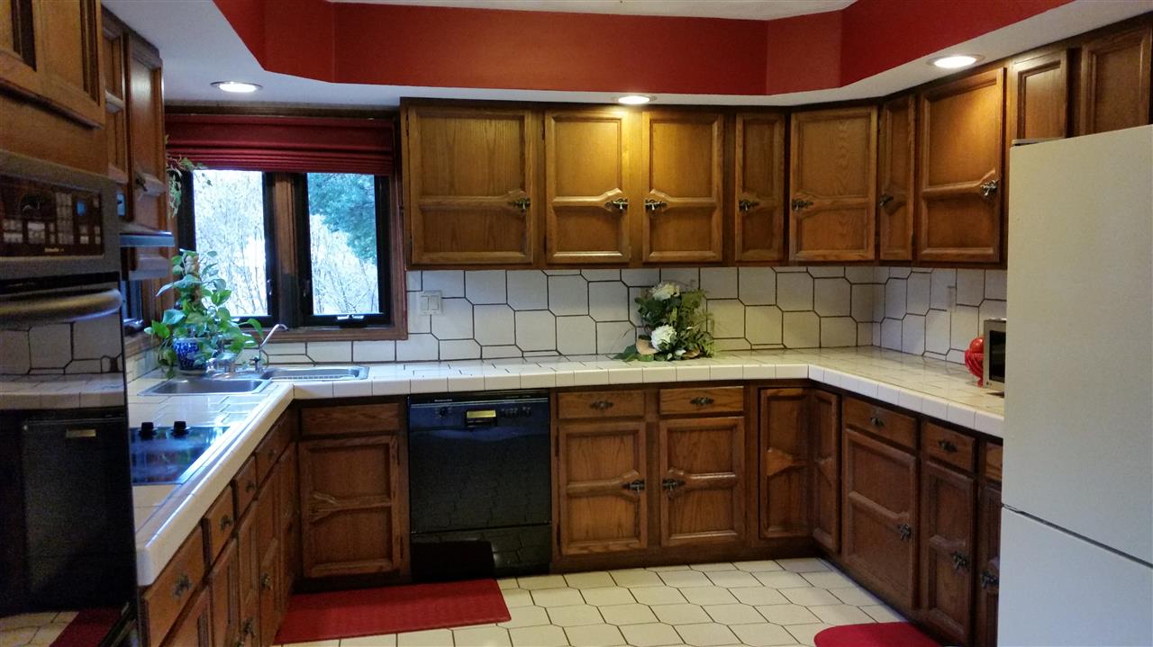 353 Cummings Road Caledonia, IL 61011 - Photo 3 of 24 a kitchen with a sink and cabinets
