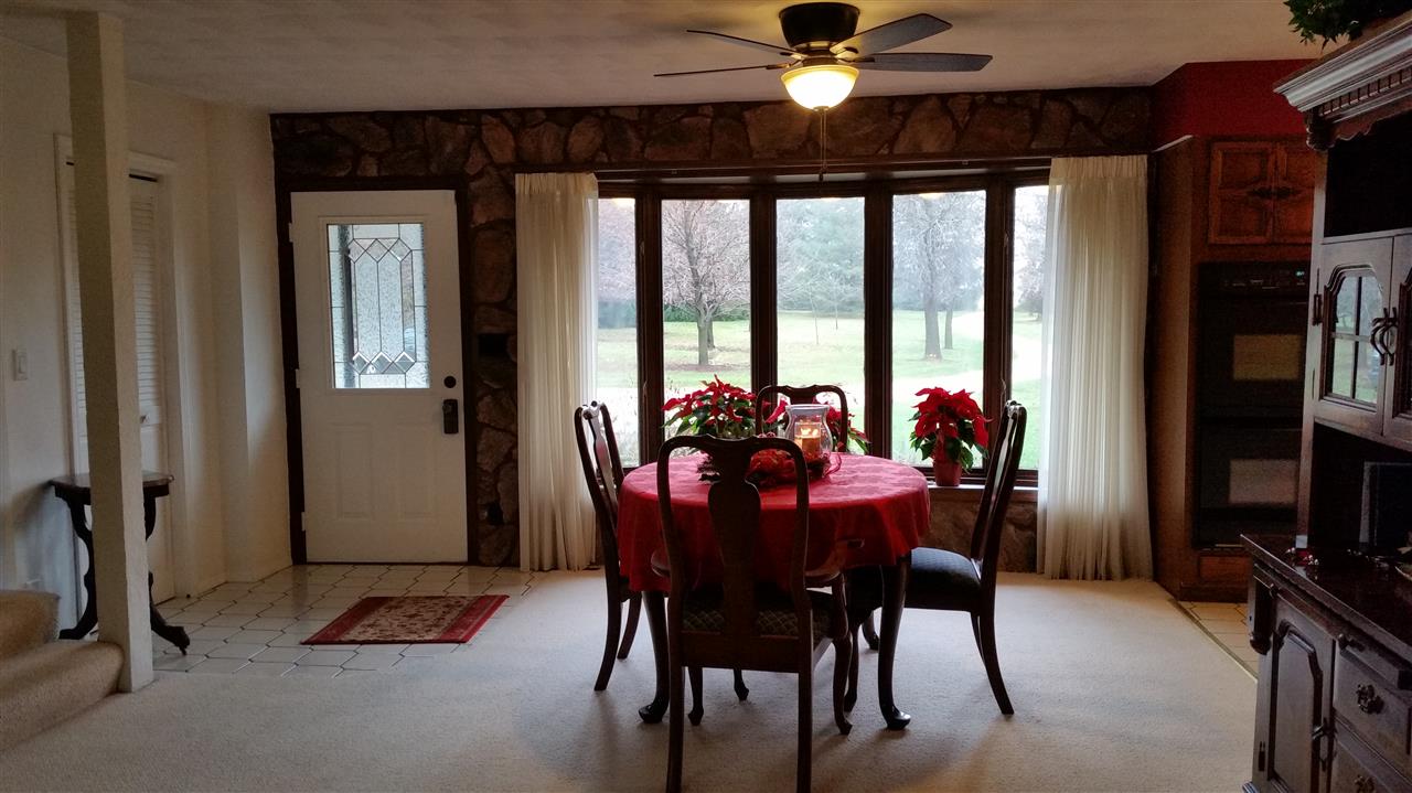 353 Cummings Road Caledonia, IL 61011 - Photo 6 of 24 a view of a dining room with furniture window and outside view