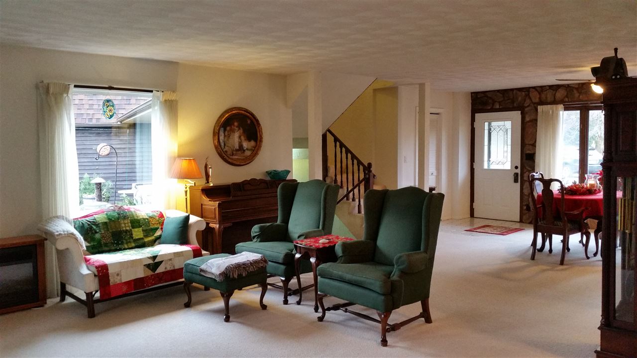 353 Cummings Road Caledonia, IL 61011 - Photo 9 of 24 a living room with furniture and a large window