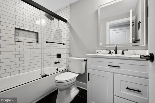 a view of a room with wooden floor and a window