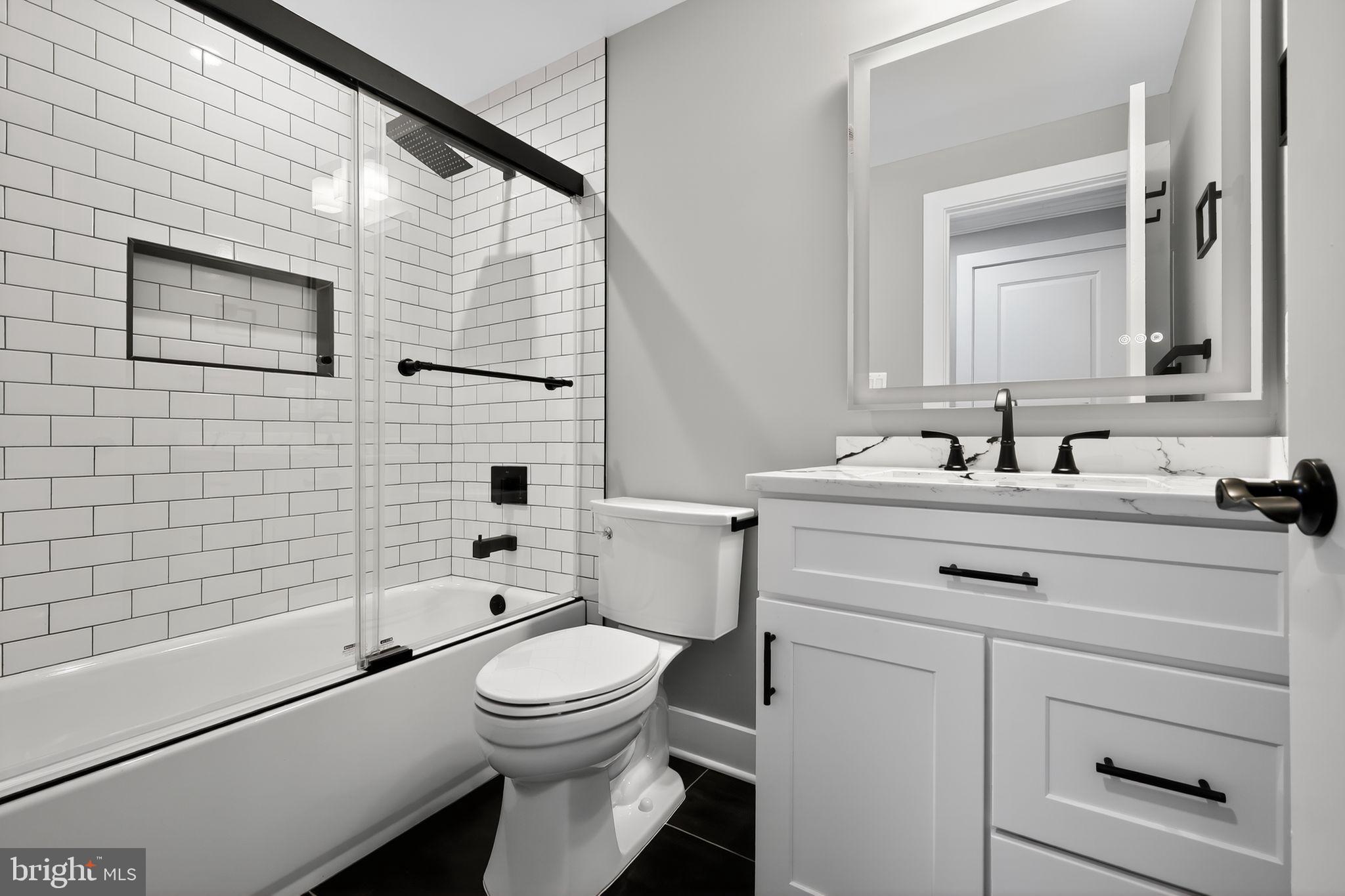 1 Tucker Street Annapolis, MD 21401 - Photo 21 of 46 a bathroom with a sink a toilet and shower