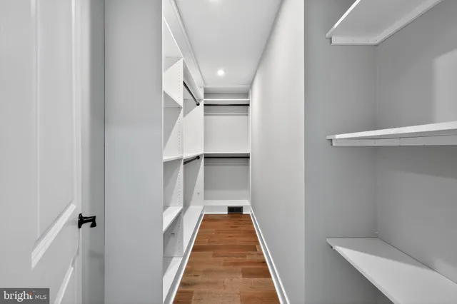 a view of room with wooden floor