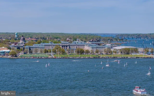 a view of a house with wooden floor and a iron gate