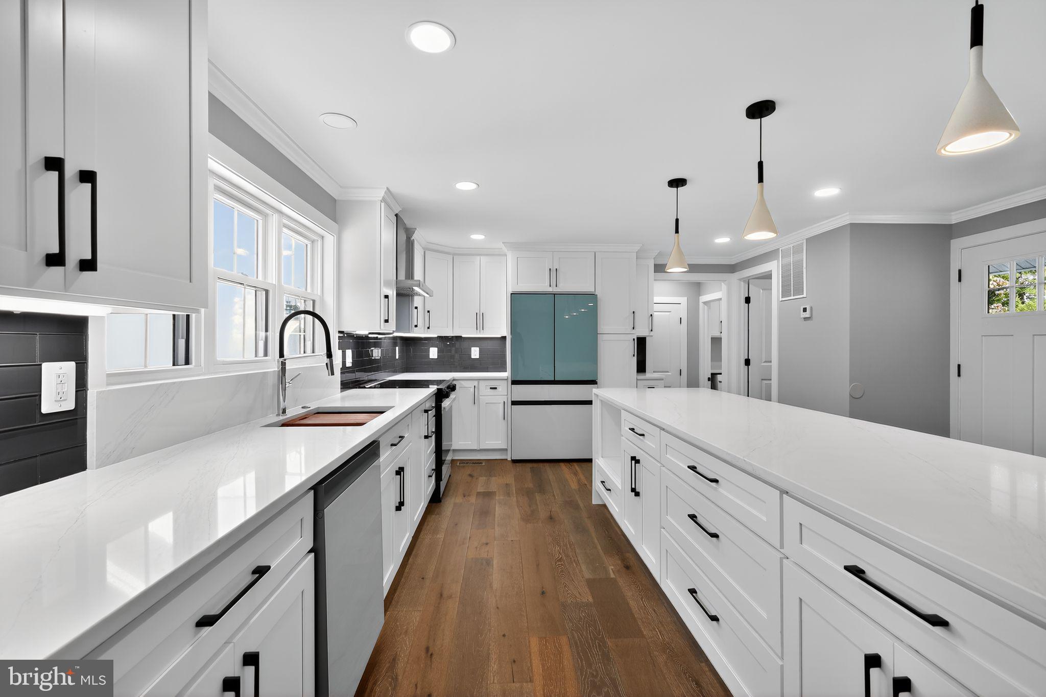 1 Tucker Street Annapolis, MD 21401 - Photo 9 of 46 a large kitchen with granite countertop a large counter top space a sink stainless steel appliances and cabinets