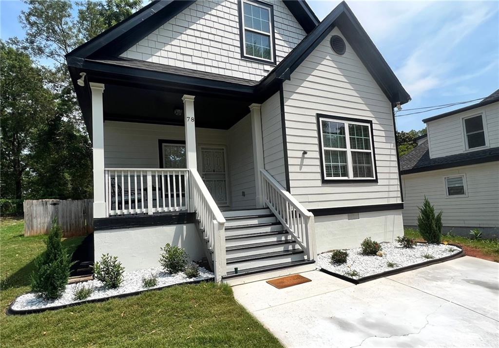 78 Bisbee Avenue Southeast Atlanta, GA 30315 - Photo 1 of 1 a front view of a house with garden