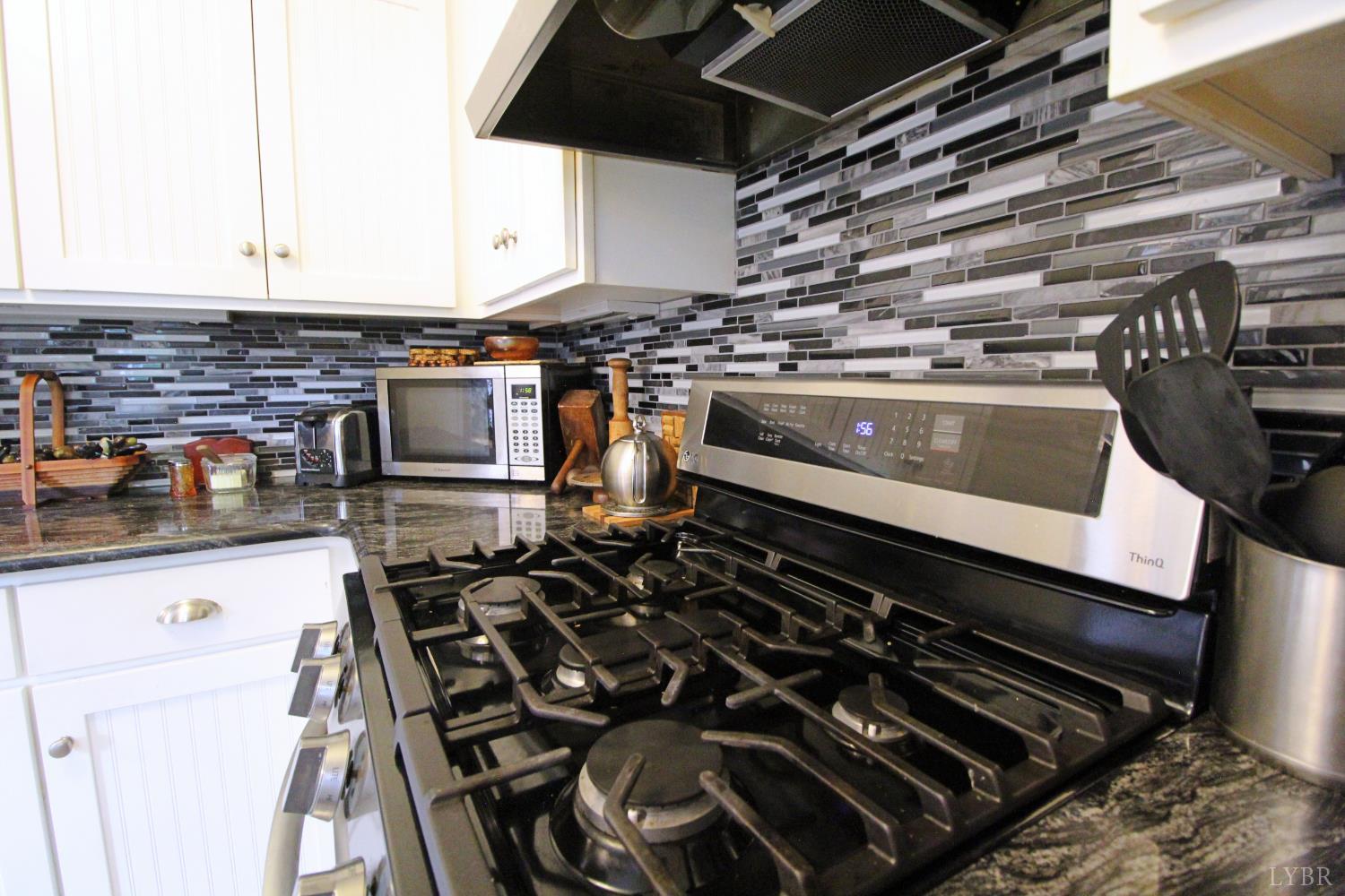 1538 Redfields Road Appomattox, VA 24522 - Photo 19 of 60 a stove top oven sitting inside of a kitchen