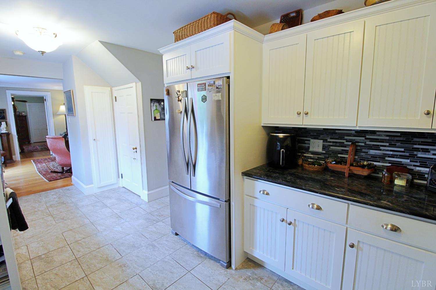 1538 Redfields Road Appomattox, VA 24522 - Photo 20 of 60 a kitchen with stainless steel appliances a refrigerator and cabinets