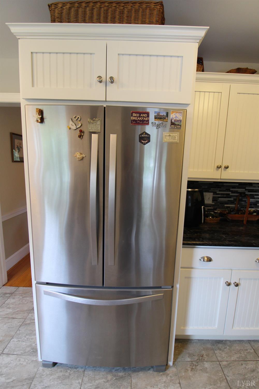 1538 Redfields Road Appomattox, VA 24522 - Photo 23 of 60 a view of a refrigerator in kitchen and an empty room