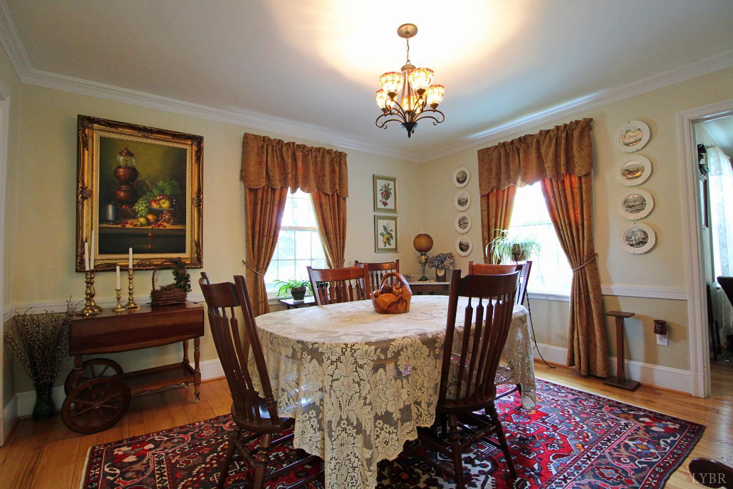 1538 Redfields Road Appomattox, VA 24522 - Photo 26 of 60 a view of a dining room with furniture window and wooden floor