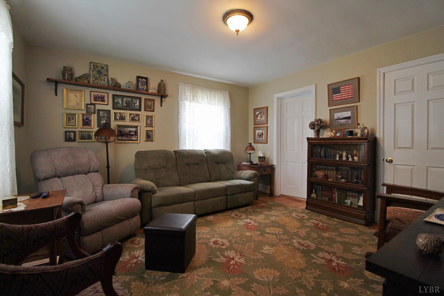 1538 Redfields Road Appomattox, VA 24522 - Photo 28 of 60 a living room with furniture and wooden floor