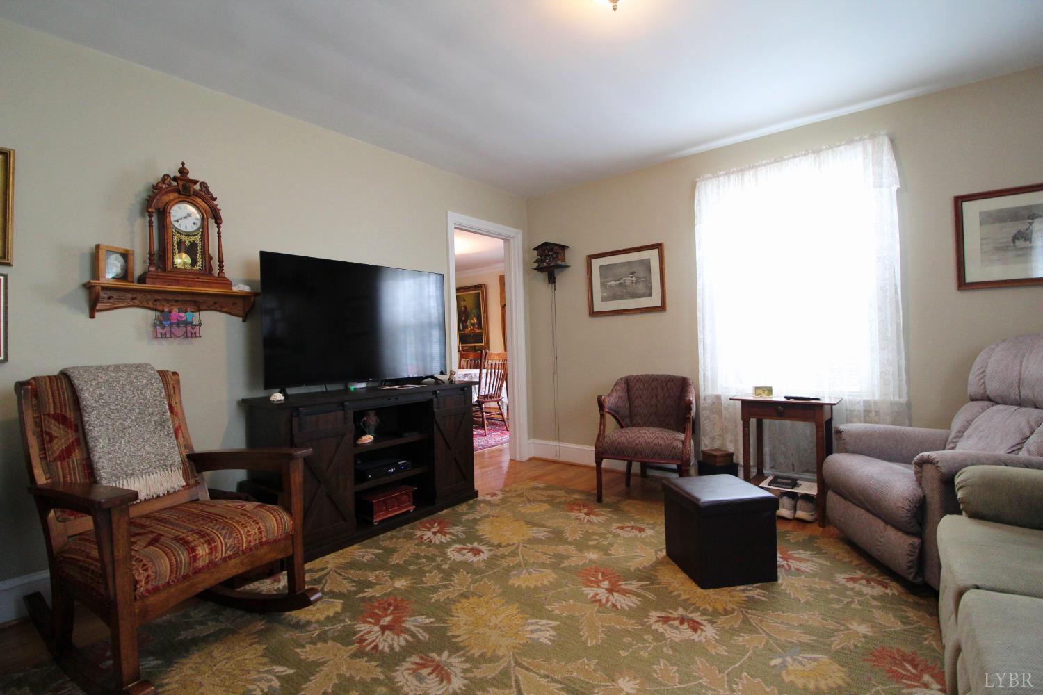 1538 Redfields Road Appomattox, VA 24522 - Photo 29 of 60 a living room with furniture and a flat screen tv