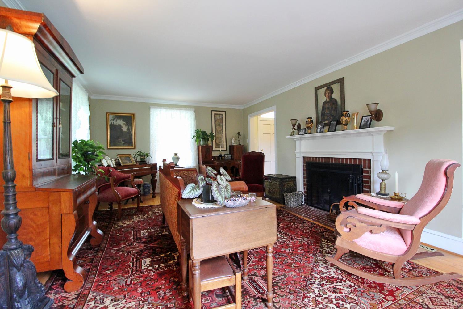 1538 Redfields Road Appomattox, VA 24522 - Photo 32 of 60 a living room with furniture a fireplace and a window