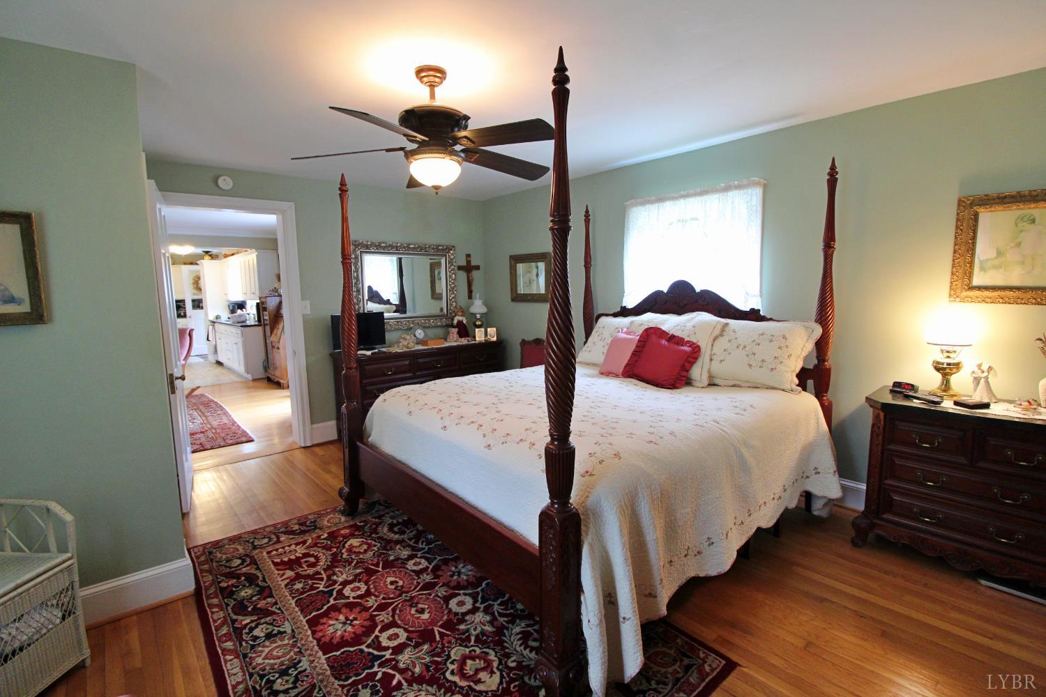1538 Redfields Road Appomattox, VA 24522 - Photo 34 of 60 a bedroom with bed and wooden floor