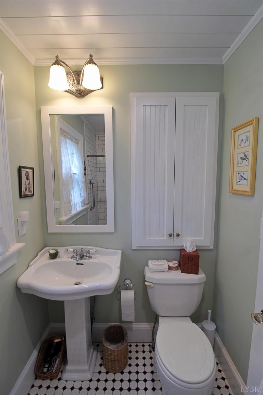1538 Redfields Road Appomattox, VA 24522 - Photo 35 of 60 a bathroom with a sink a toilet and mirror