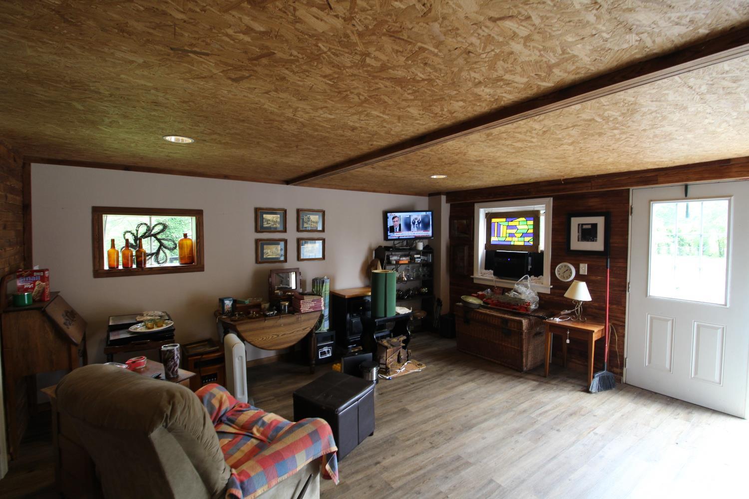 1538 Redfields Road Appomattox, VA 24522 - Photo 51 of 60 a living room with furniture and wooden floor