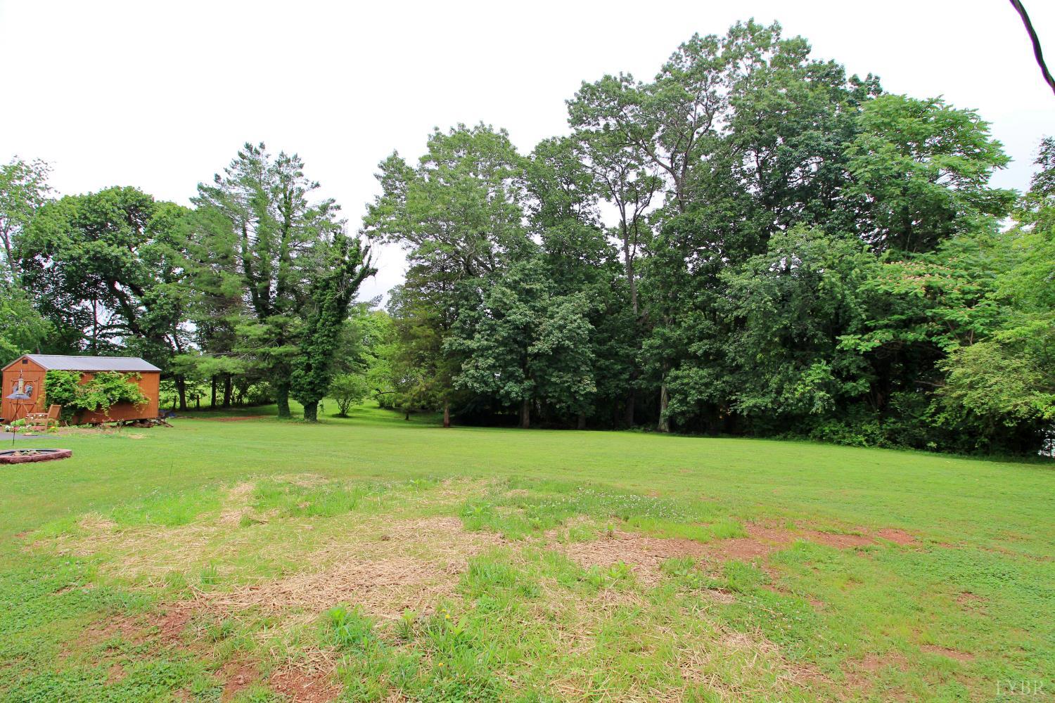 1538 Redfields Road Appomattox, VA 24522 - Photo 55 of 60 a view of a field with trees in the background
