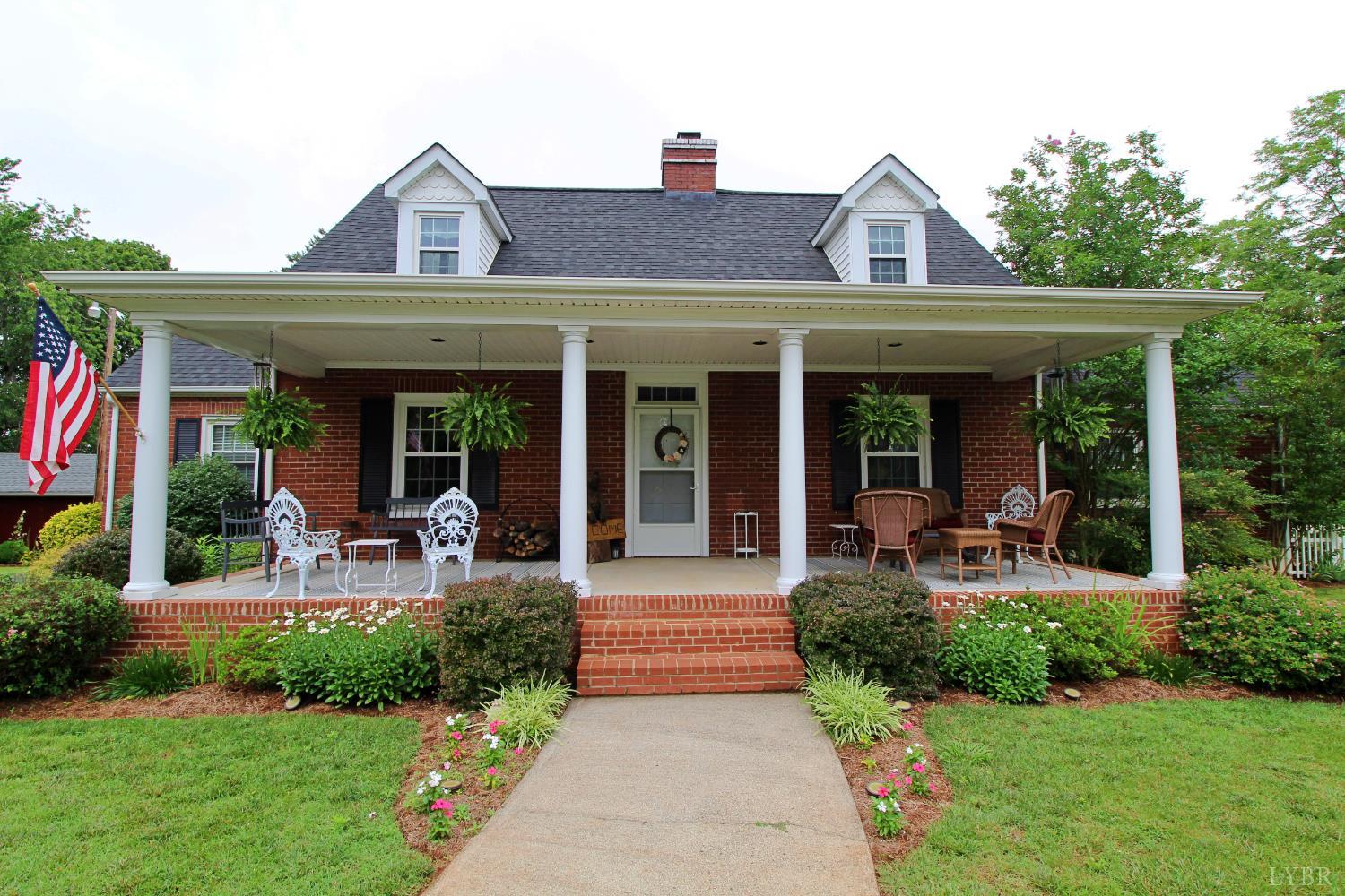1538 Redfields Road Appomattox, VA 24522 - Photo 6 of 60 a front view of a house with garden and porch
