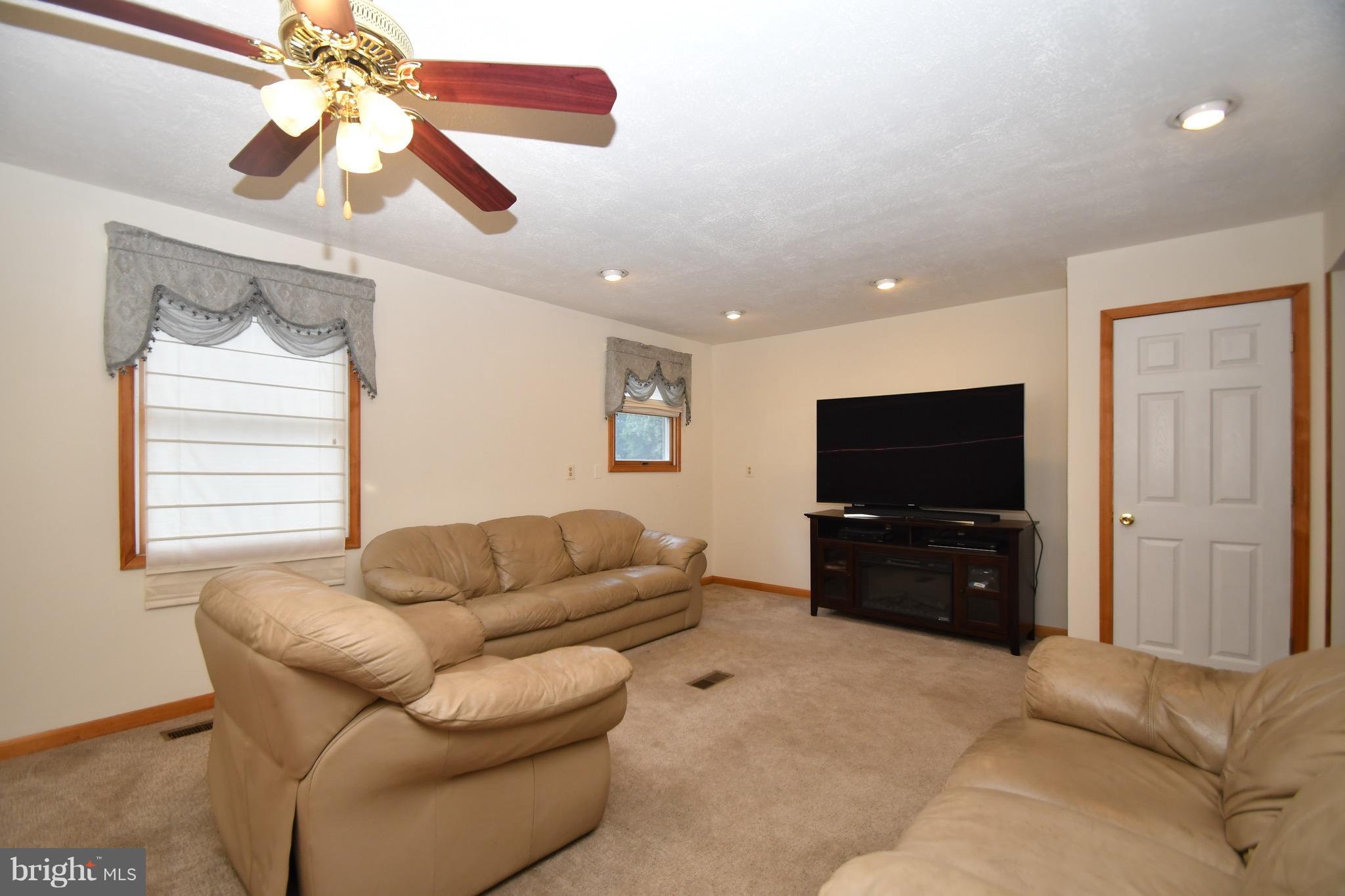 202 Sandhill Road Baltimore, MD 21221 - Photo 11 of 30 a living room with furniture and a flat screen tv