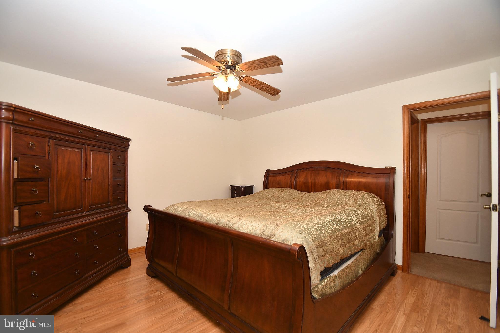 202 Sandhill Road Baltimore, MD 21221 - Photo 13 of 30 a bedroom with a bed and cabinet