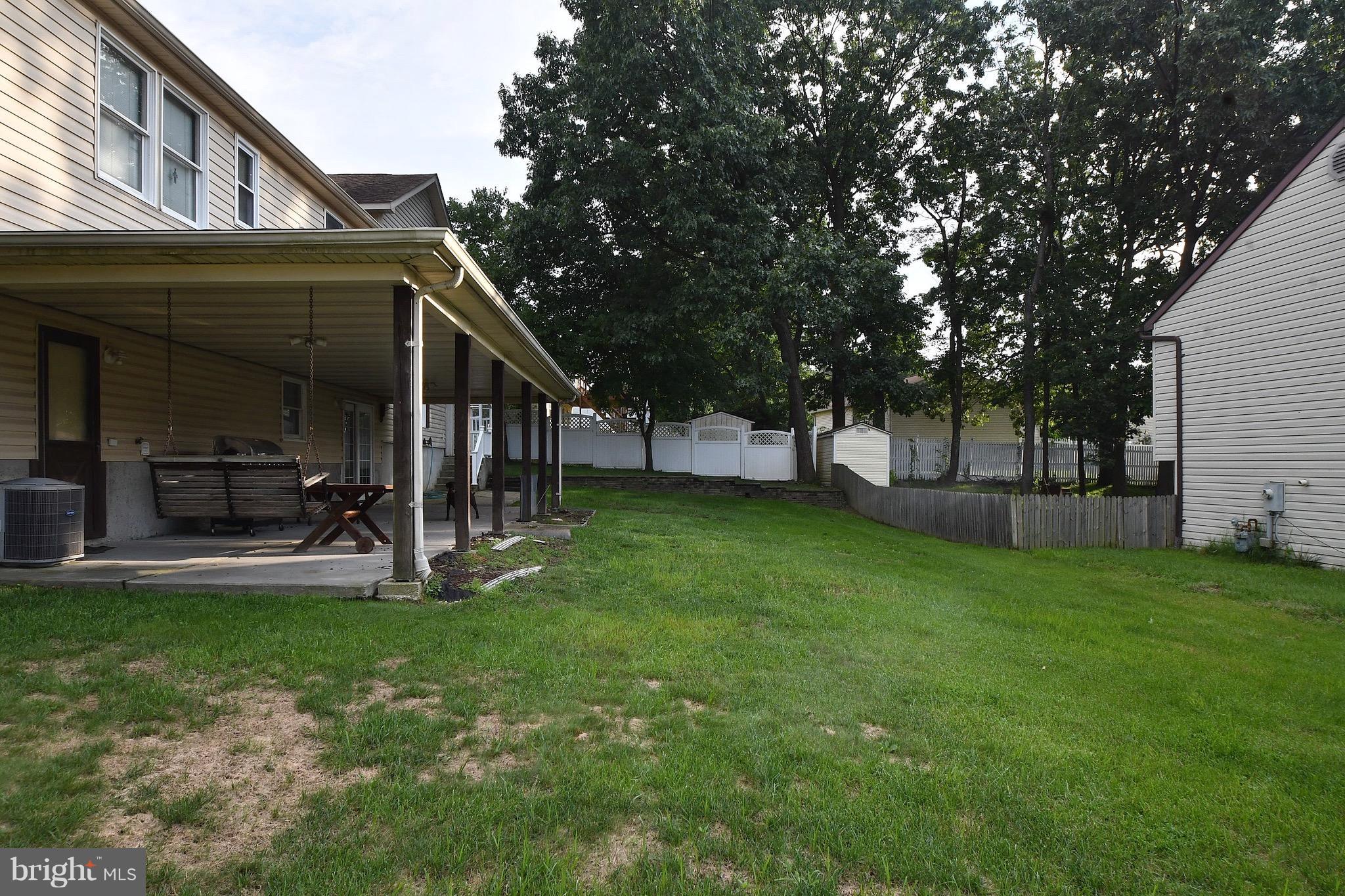 202 Sandhill Road Baltimore, MD 21221 - Photo 22 of 30 a view of house with backyard and a slide
