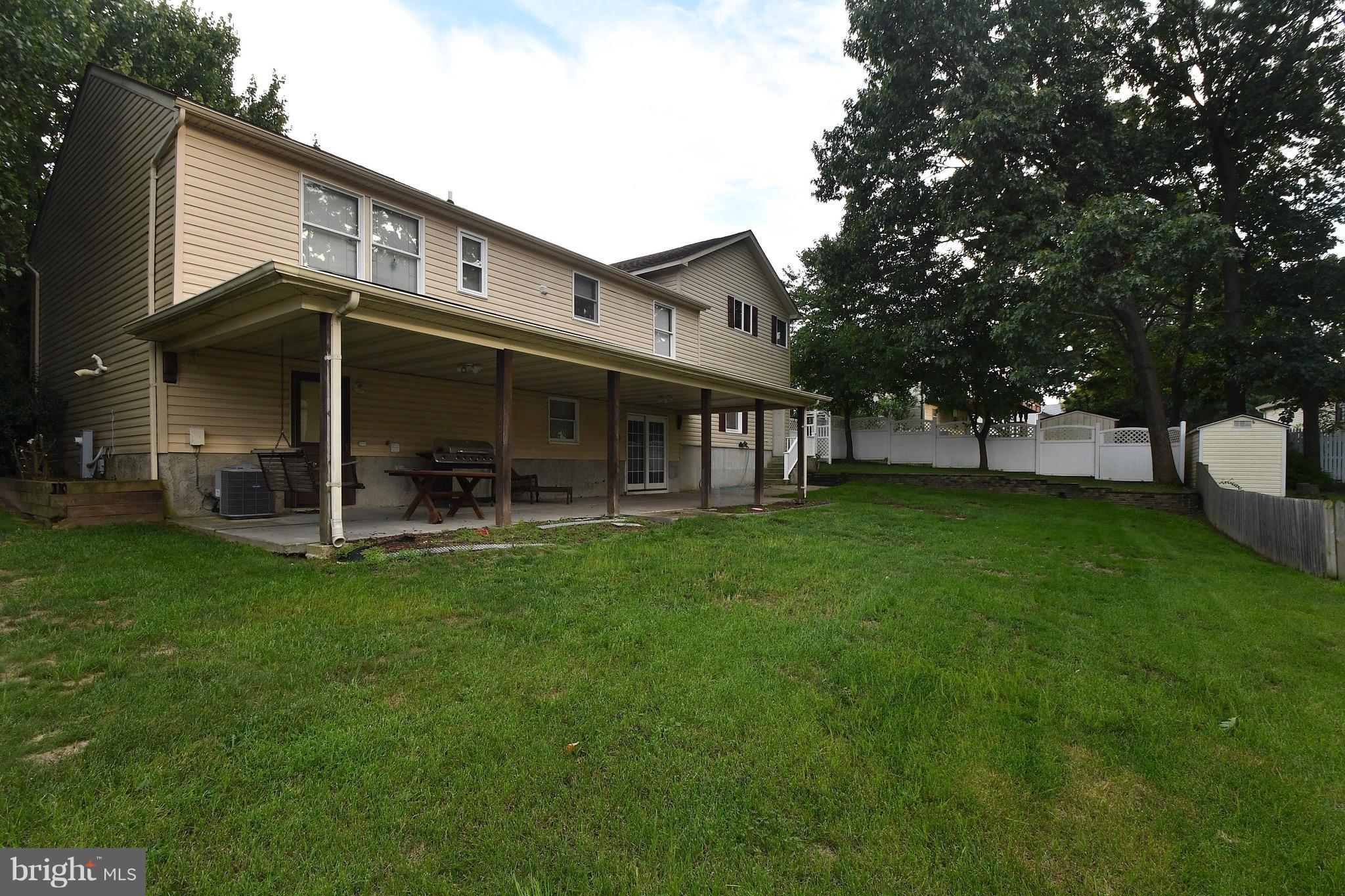 202 Sandhill Road Baltimore, MD 21221 - Photo 23 of 30 a view of a house with a yard porch and sitting area