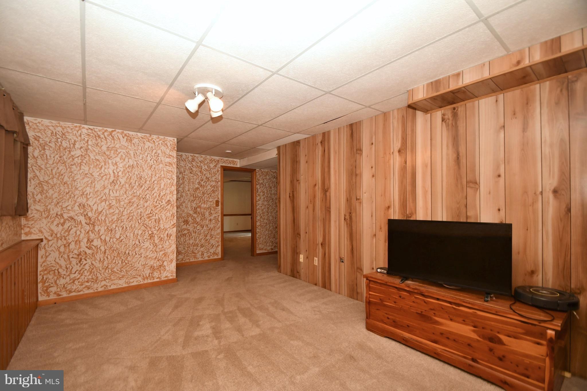202 Sandhill Road Baltimore, MD 21221 - Photo 29 of 30 a living room with furniture and a flat screen tv