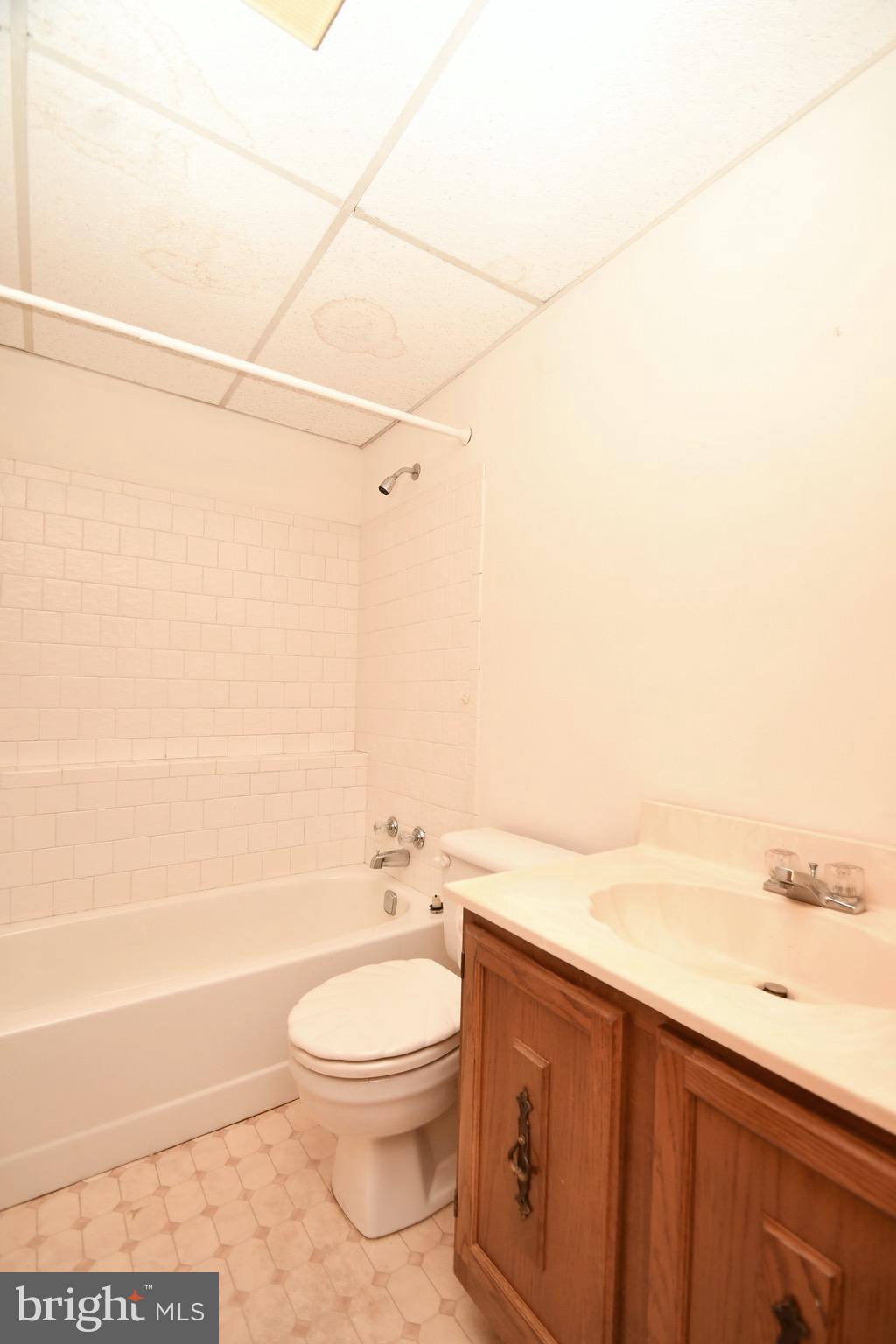 202 Sandhill Road Baltimore, MD 21221 - Photo 30 of 30 a bathroom with a toilet a sink and bathtub