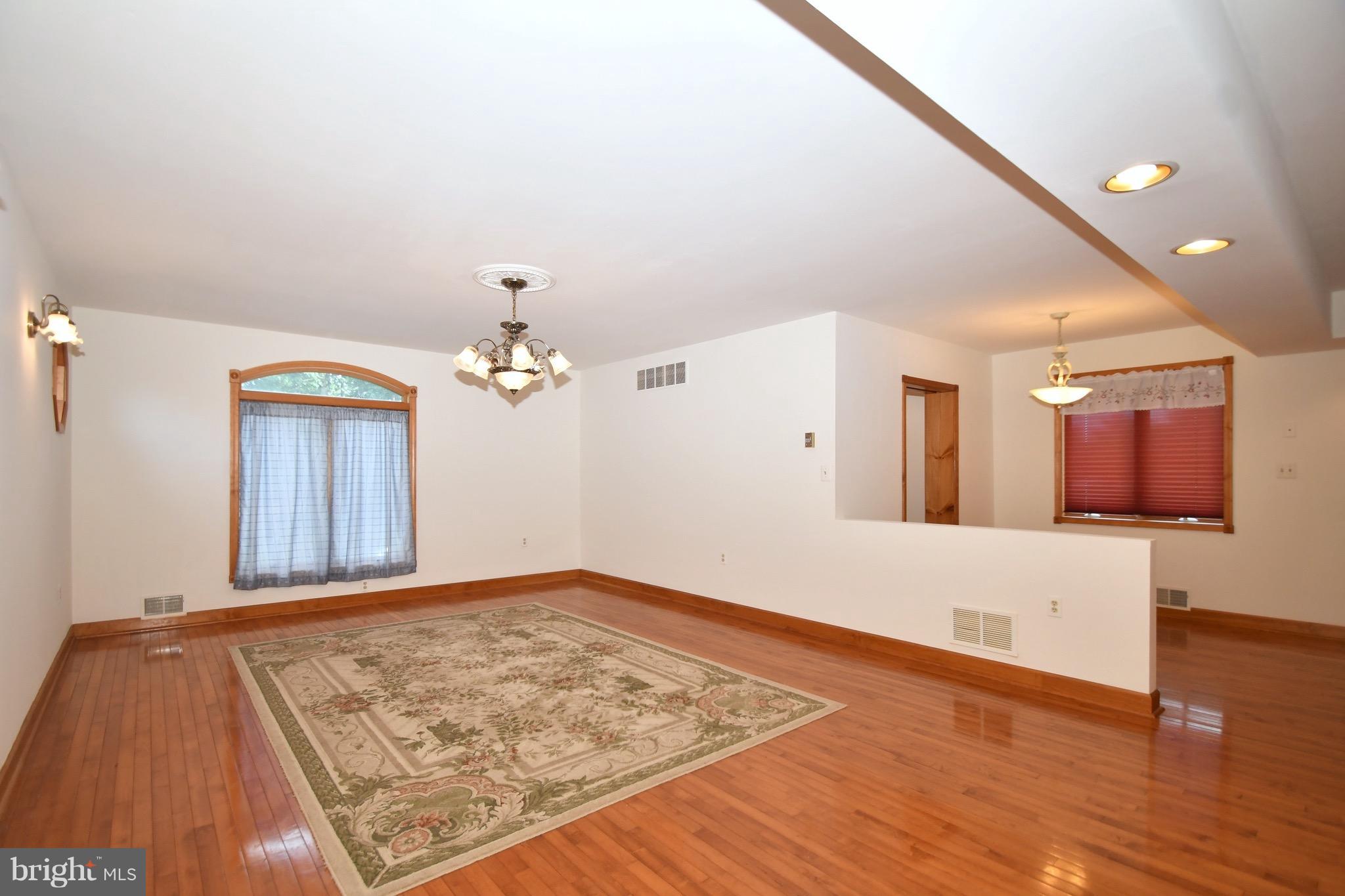 202 Sandhill Road Baltimore, MD 21221 - Photo 5 of 30 a view of a livingroom with wooden floor