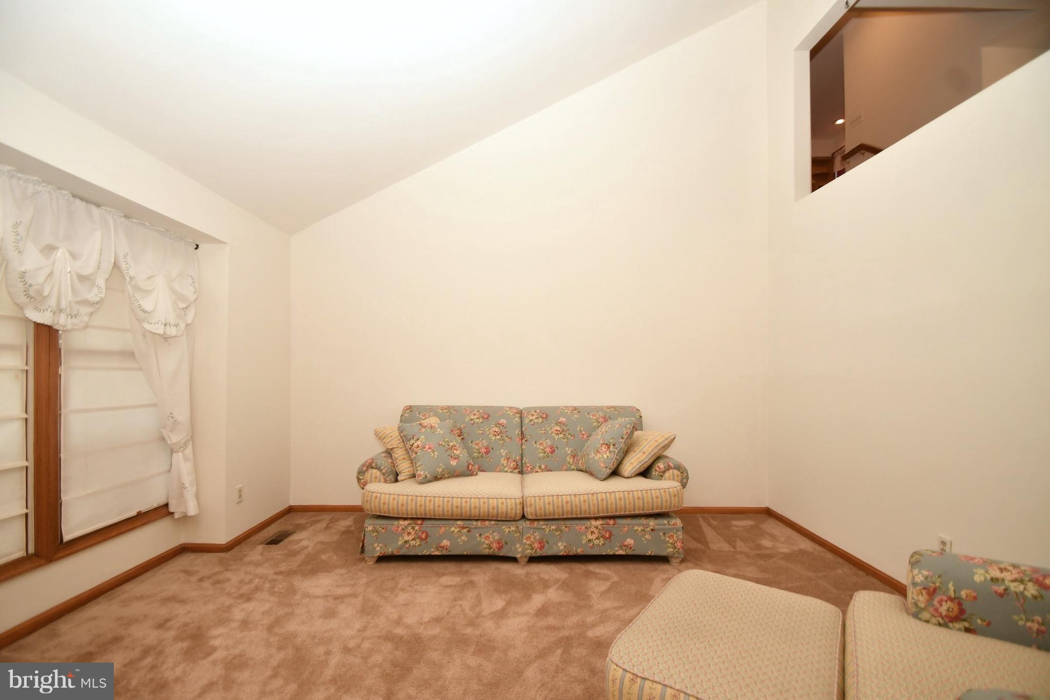 202 Sandhill Road Baltimore, MD 21221 - Photo 7 of 30 a living room with furniture and a walk in closet