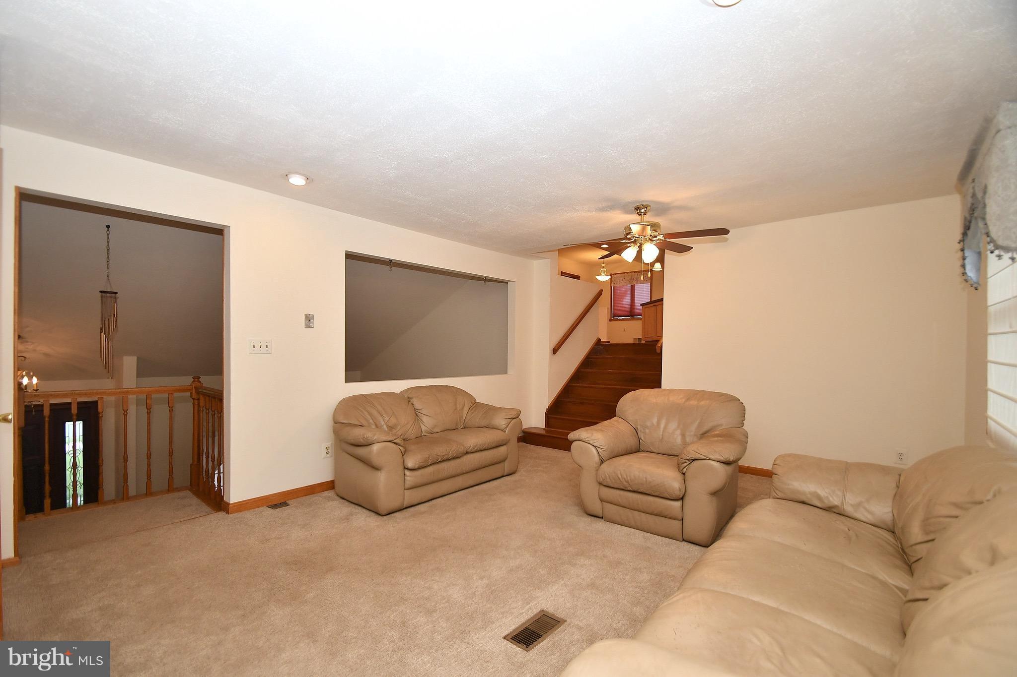 202 Sandhill Road Baltimore, MD 21221 - Photo 10 of 30 a living room with furniture and a ceiling fan