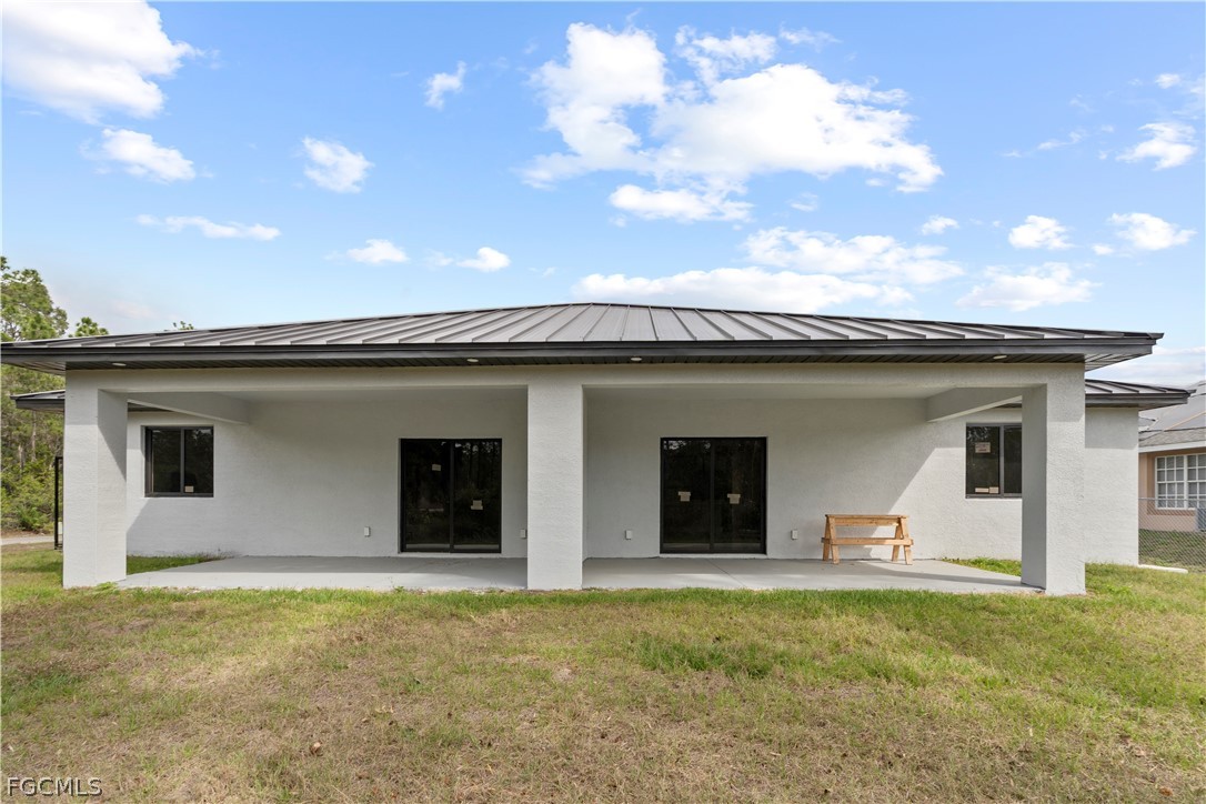 526 Knapp Street Lehigh Acres, FL 33974 - Photo 11 of 37 a view of a house with a backyard