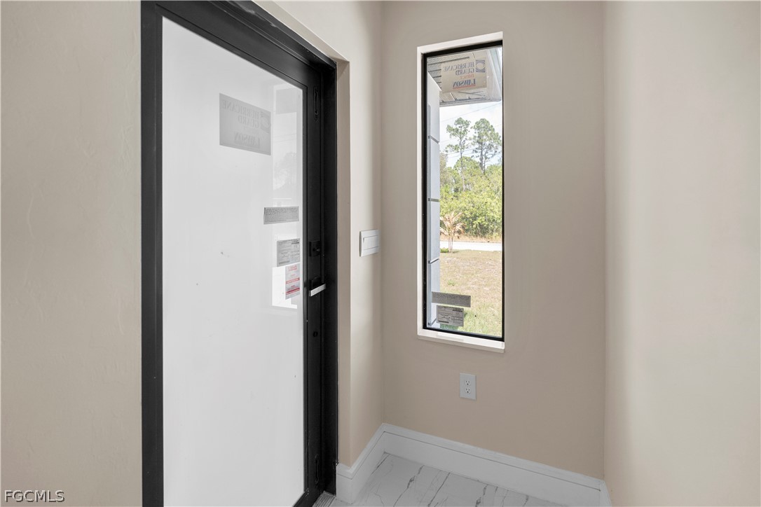 526 Knapp Street Lehigh Acres, FL 33974 - Photo 12 of 37 a view of an front door